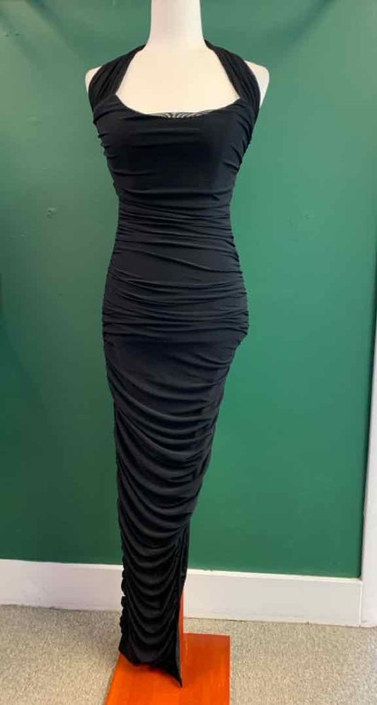 Black sleeveless ruched bodycon maxi dress with square neckline and thick straps.