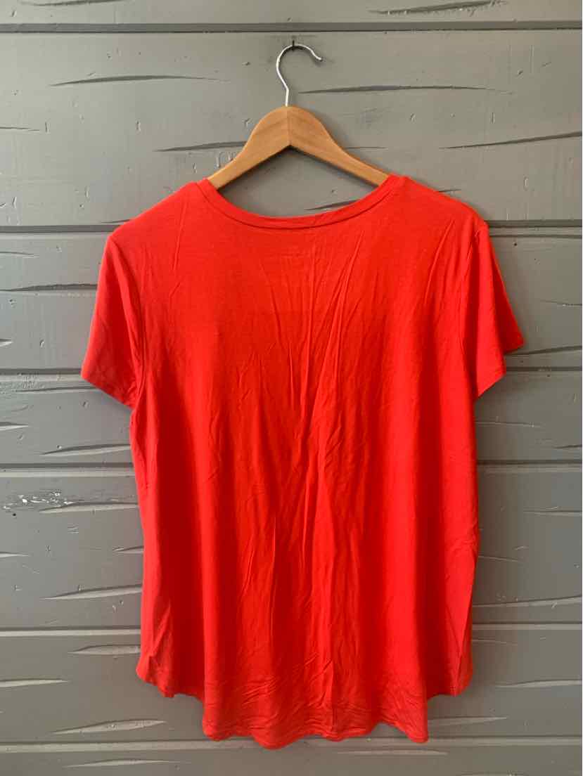 Red short-sleeve scoop neck T-shirt in medium size hanging on wooden hanger.