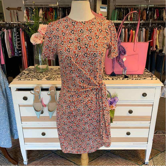 Tan floral wrap dress with short sleeves and waist tie in size 4P on mannequin.