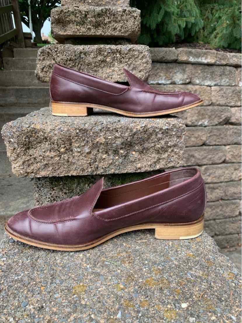Brown leather slip-on loafers with almond toe and low wooden block heel, size 10.5.