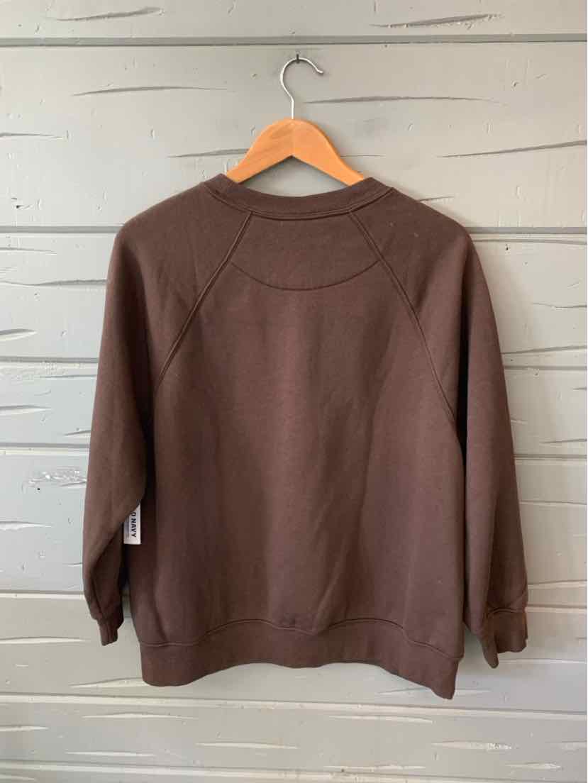 Brown crewneck sweatshirt with raglan sleeves and ribbed cuffs, hanging on wooden hanger.