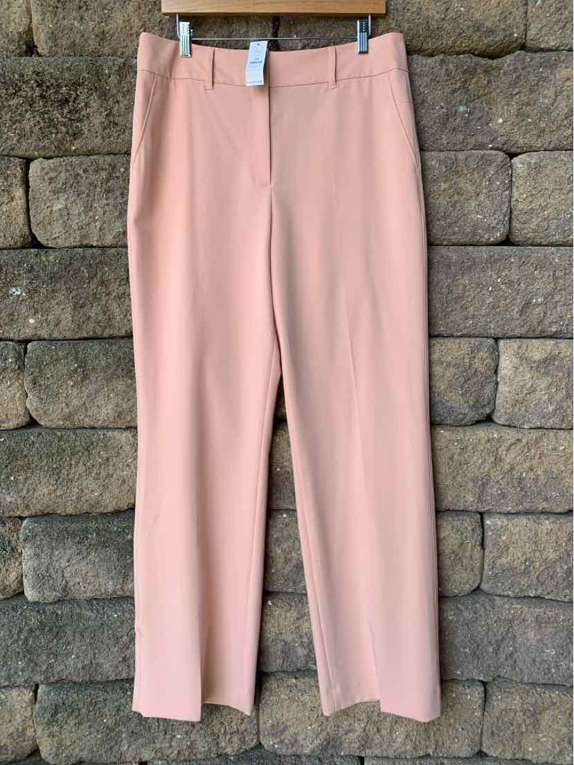 Light pink straight-leg dress pants with belt loops and front zipper closure.