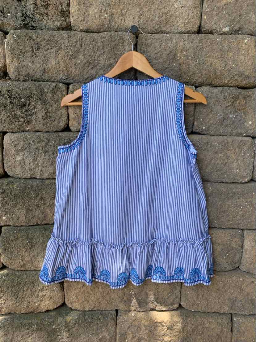 Blue and white striped sleeveless top with ruffled hem and embroidered blue detailing, size medium.