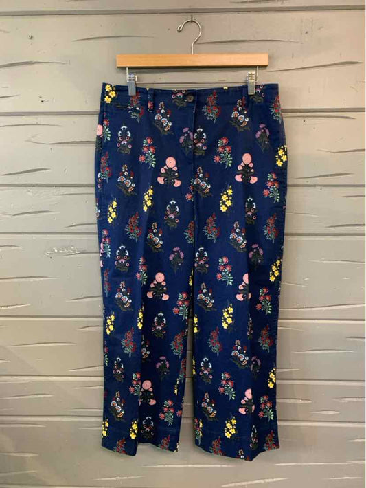 Navy blue cropped pants with colorful floral print and straight-leg cut.