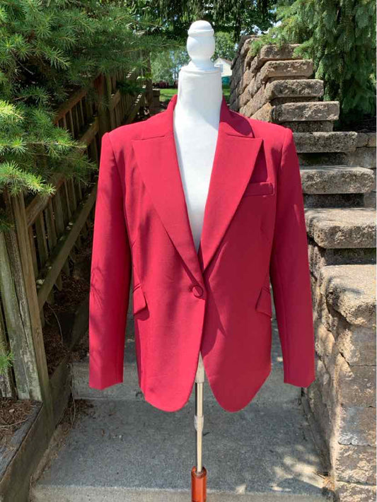 Red tailored blazer in XL with notch lapels and front flap pockets, displayed on mannequin outdoors.