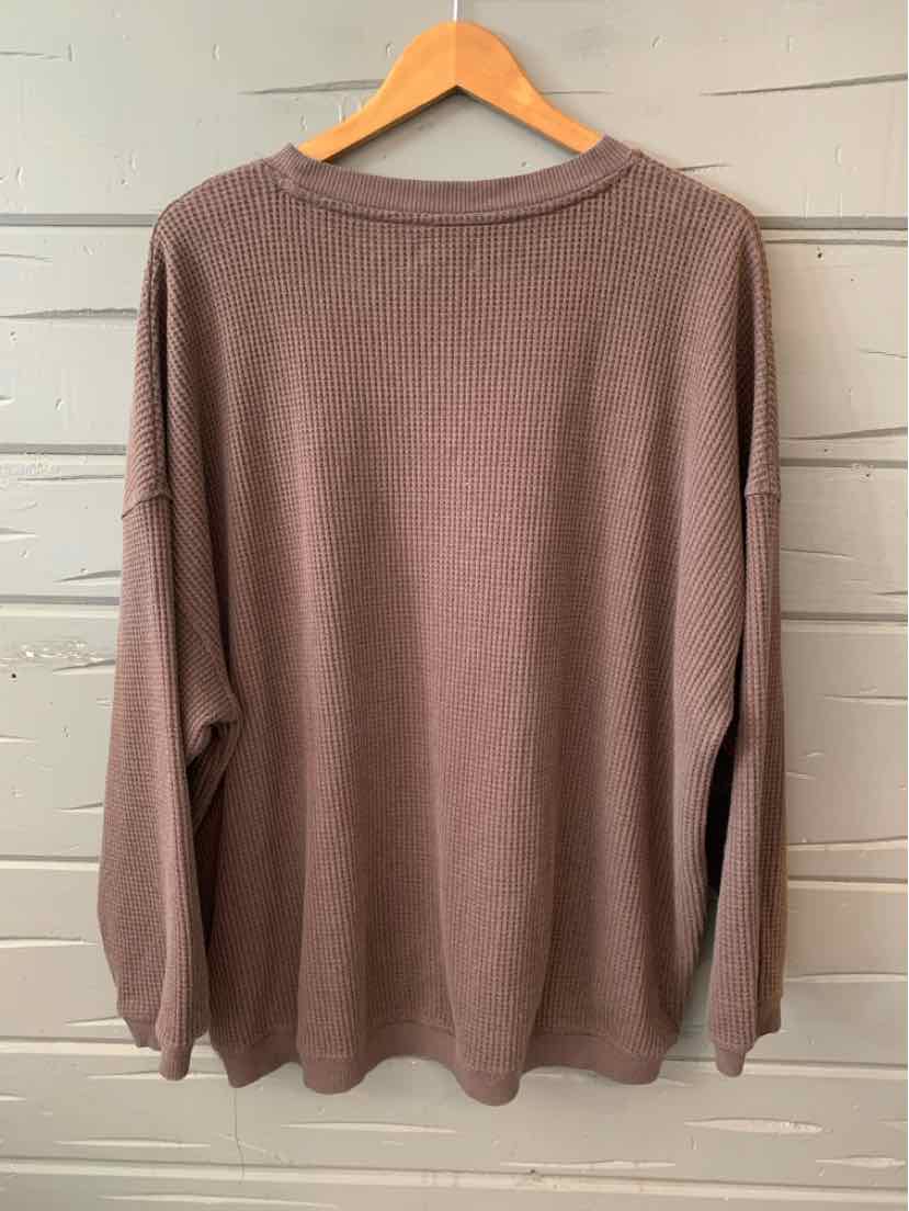 Long-sleeve oversized pullover sweater in muted mauve with crew neckline and relaxed fit.