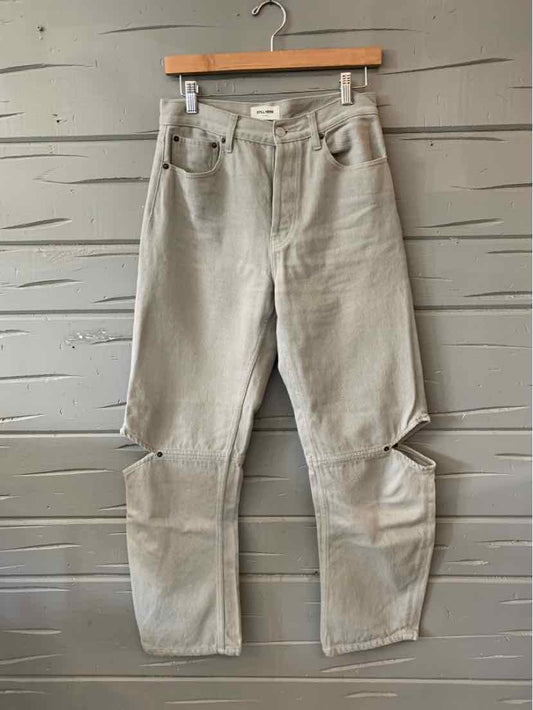 Light gray denim jeans with high waist and relaxed fit, featuring front pockets and knee cutouts.