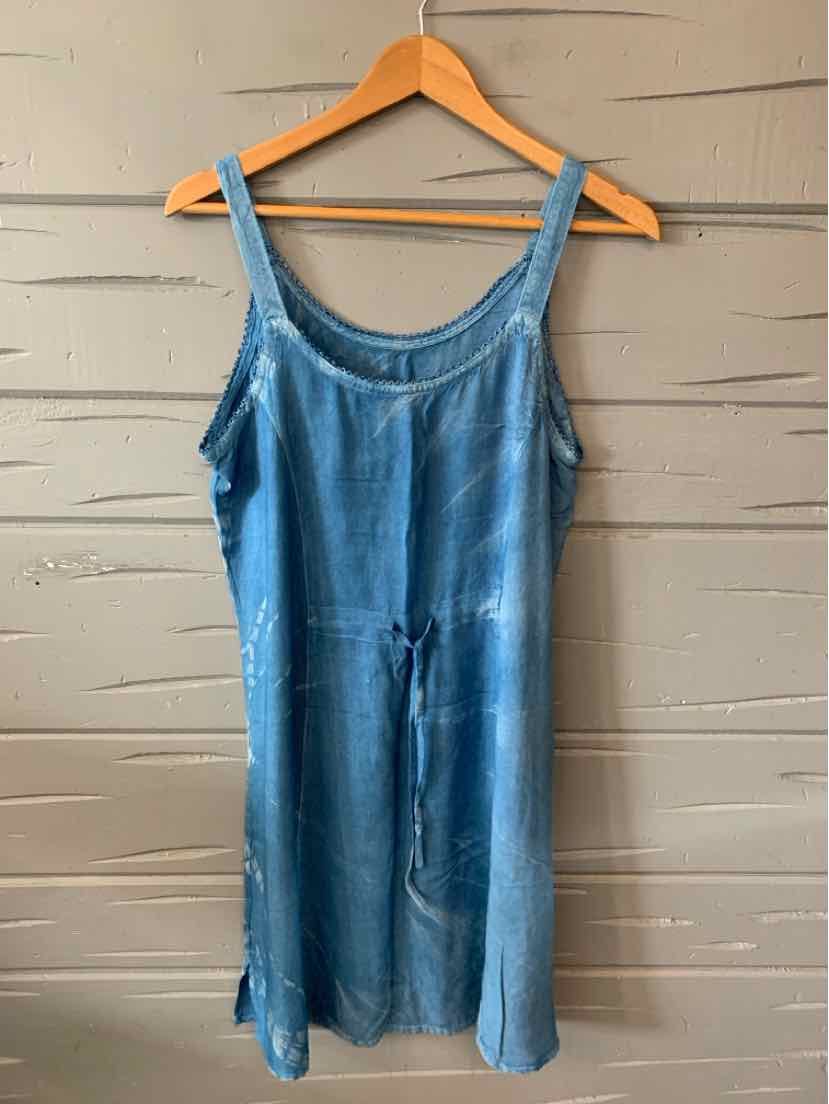 Light blue sleeveless denim dress with scoop neckline and drawstring waist hanging on wooden hanger.