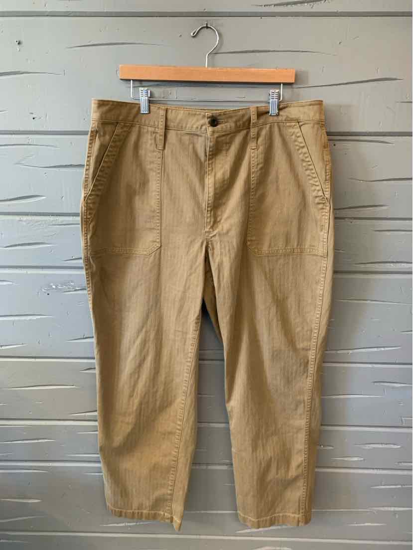 Tan cotton pants with straight legs, front button and zip closure, and side pockets, size 16.
