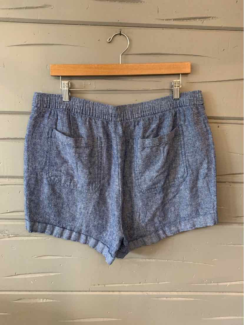 Blue textured fabric women's shorts with elastic waistband and front pockets, size large.
