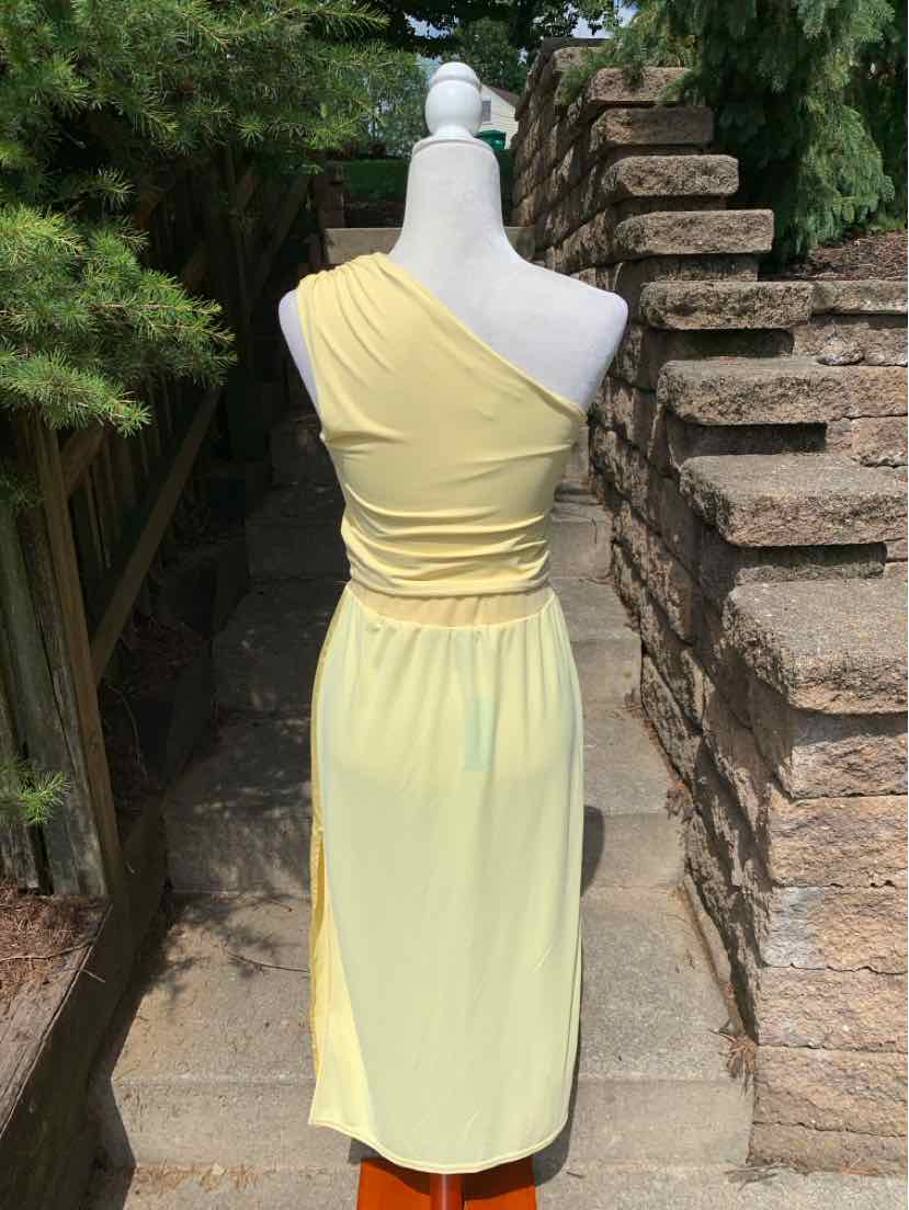 Light yellow one-shoulder midi dress with ruched waist and soft, flowy fabric.