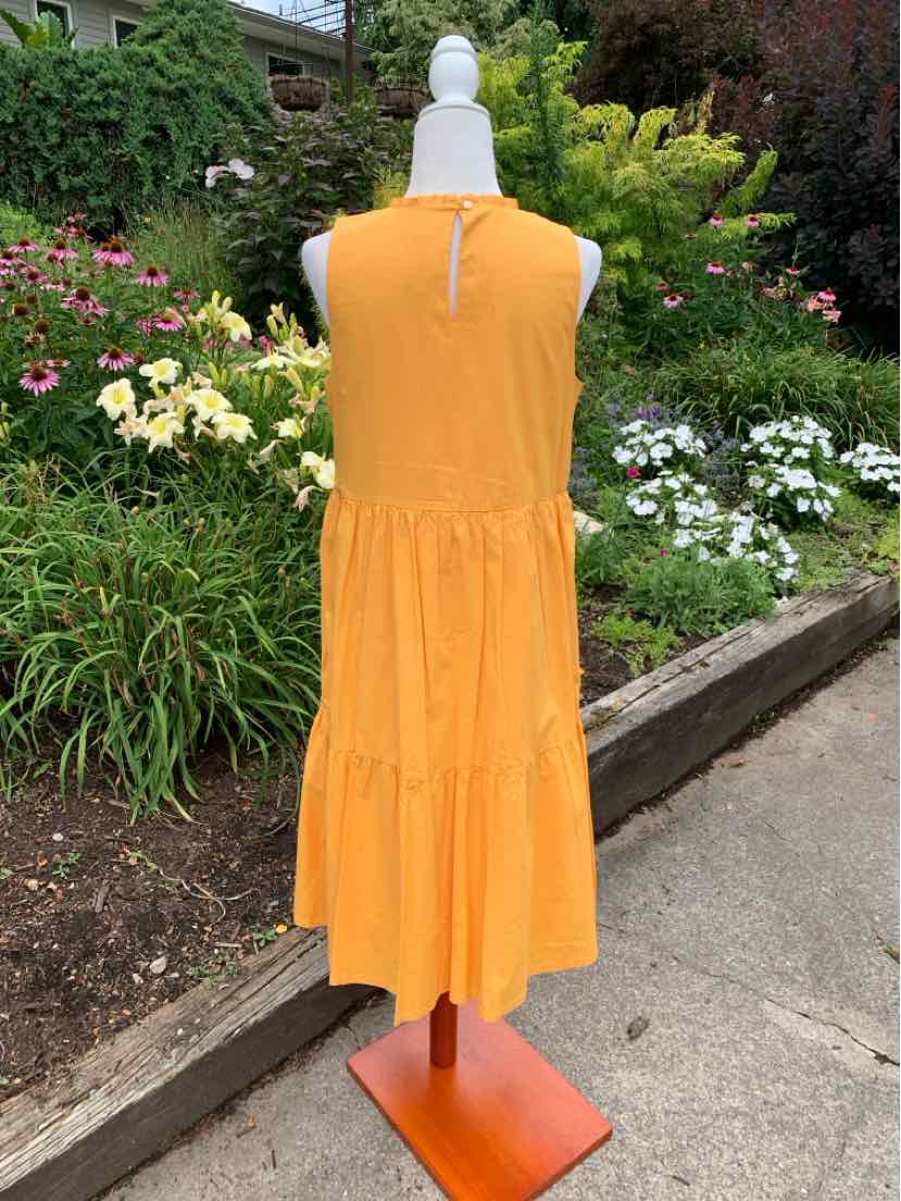 Sleeveless bright orange midi dress with tiered skirt and keyhole button closure at back neckline.