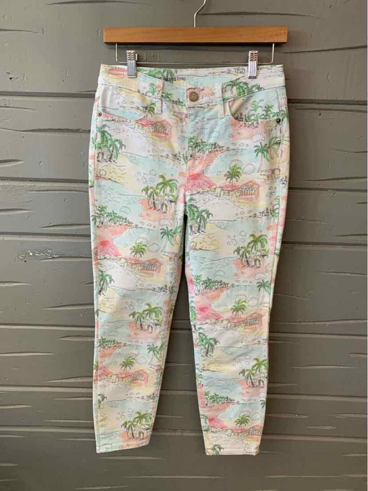 White skinny pants with tropical print in green and pink, button and zip closure, size 2.