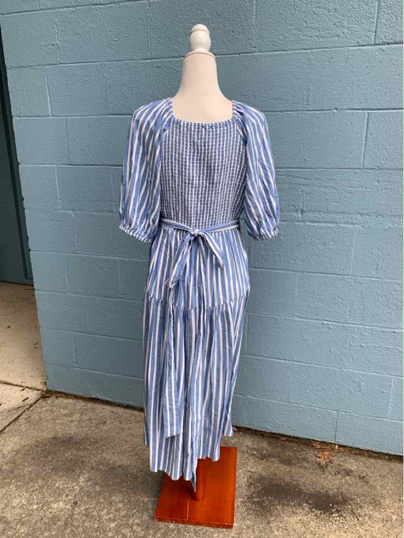 Blue and white vertical striped midi dress with elbow-length puff sleeves and a tie-back waist.