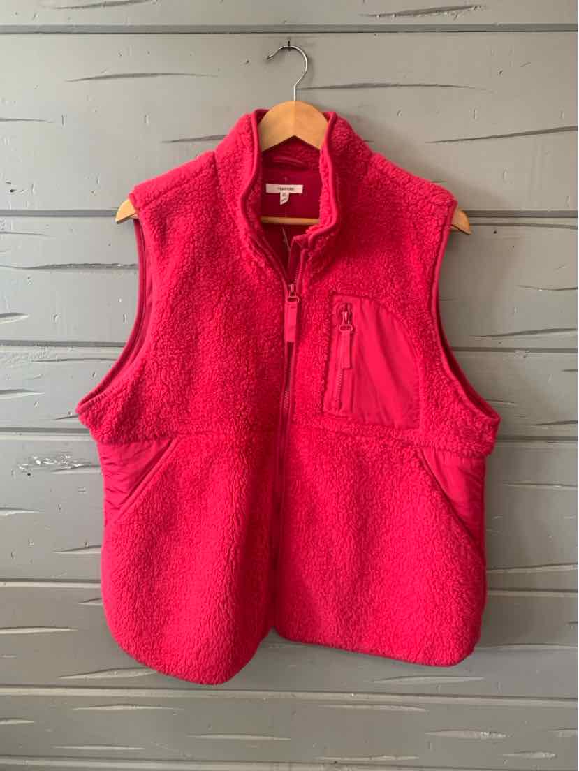 Bright pink fleece vest with a front zipper and zippered chest pocket, sleeveless design.