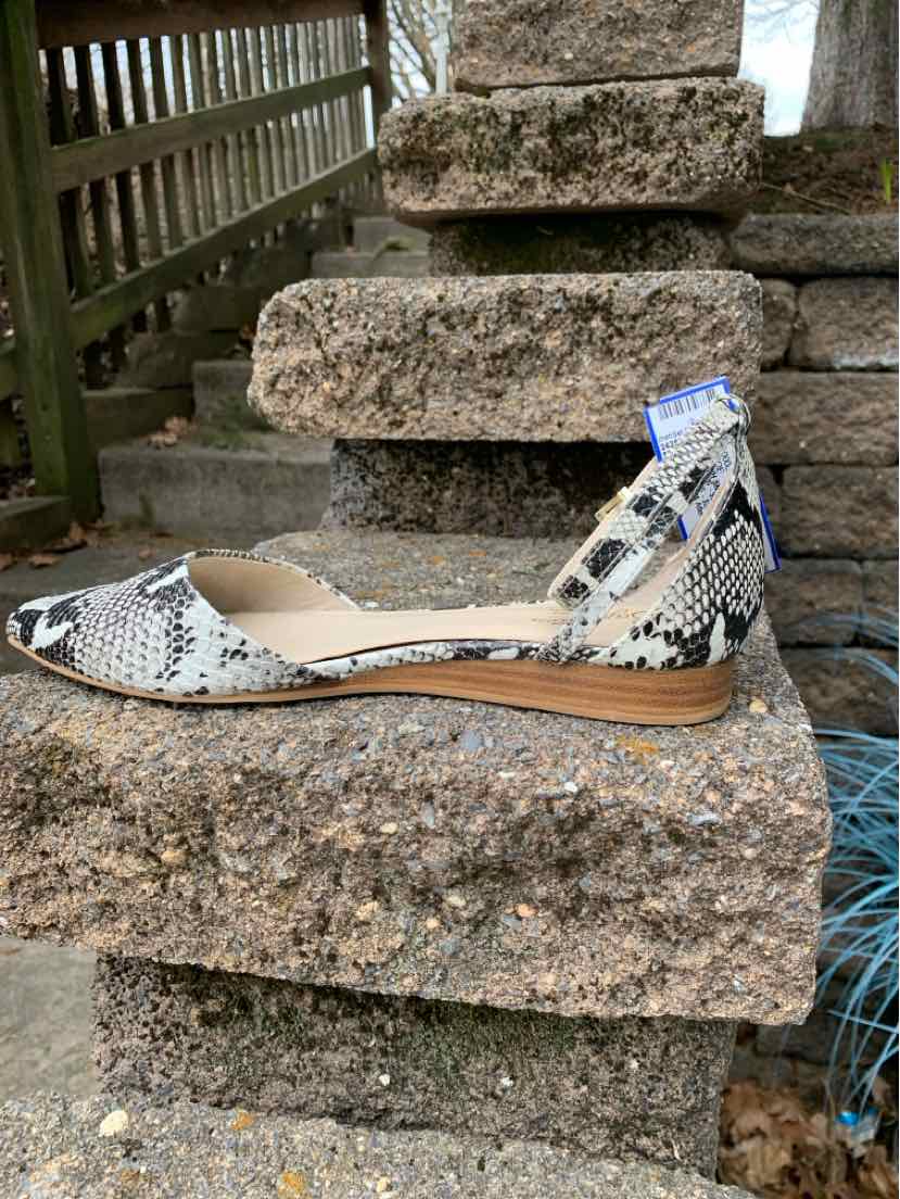 Black and white snake print flat shoe with pointed toe and ankle strap, size 8.5.