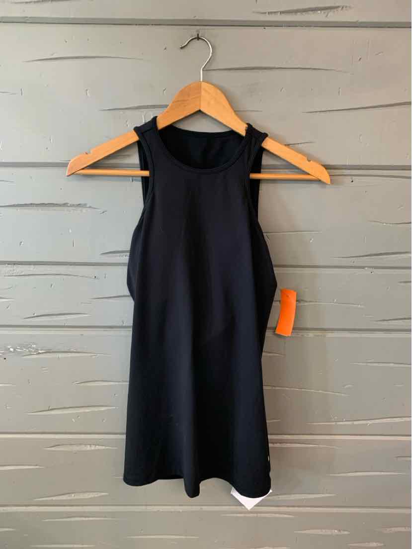 Black sleeveless athletic tank top with high neckline and fitted silhouette hanging on wooden hanger.