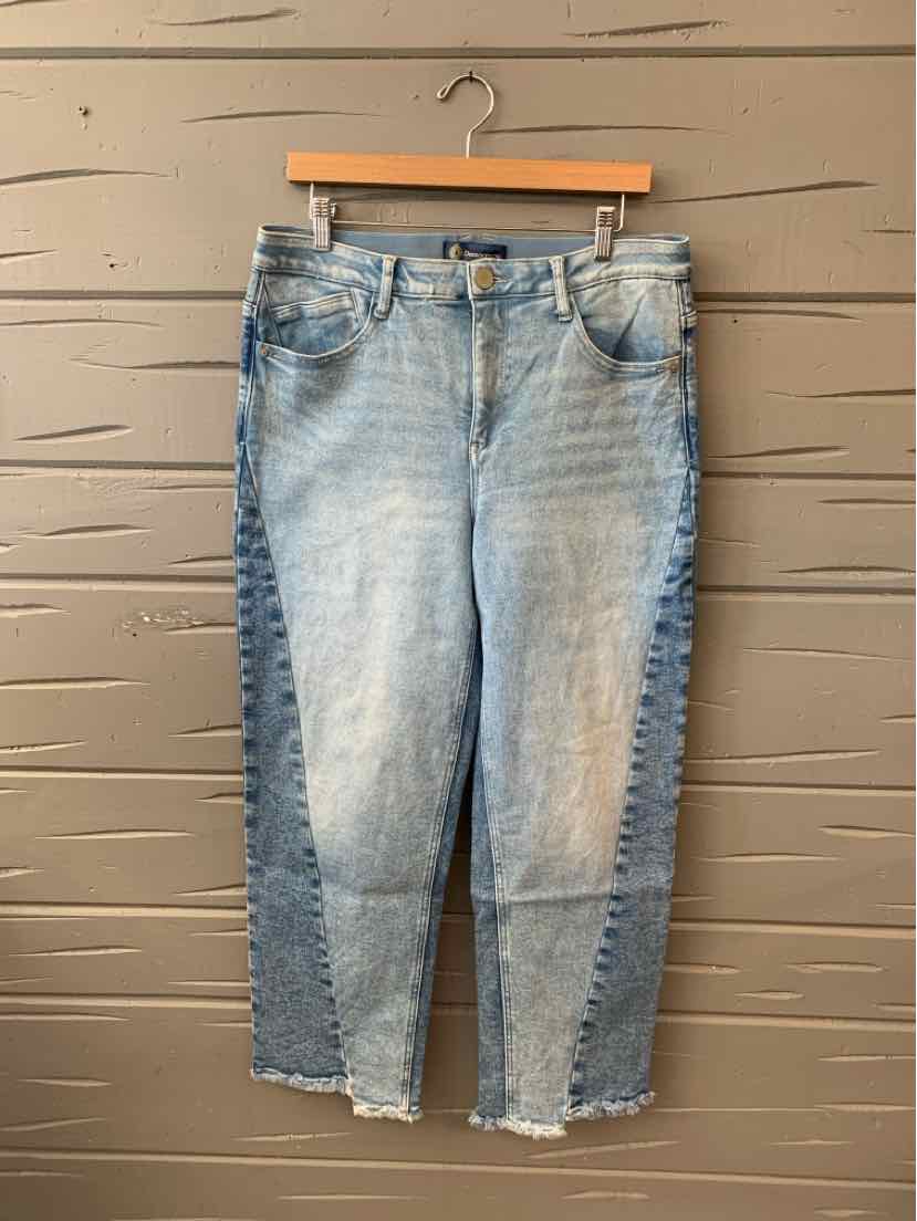 Light blue denim jeans with dark blue side panels, five-pocket style, and frayed hem at ankle length.