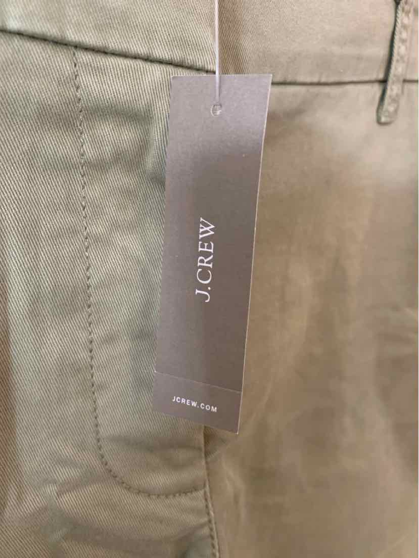 Khaki cotton pants with front pocket and attached J.Crew branded gray tag.