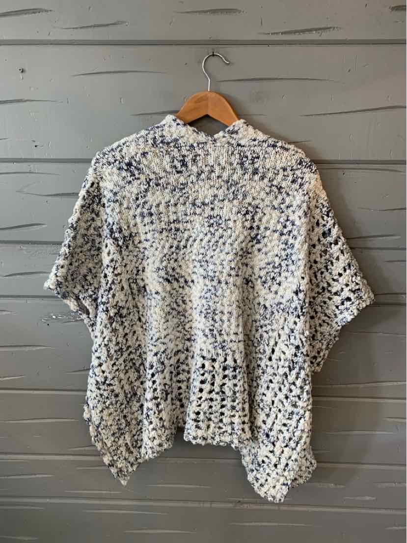 Loose-knit open-front cardigan in white and navy blue with a relaxed, draped fit.
