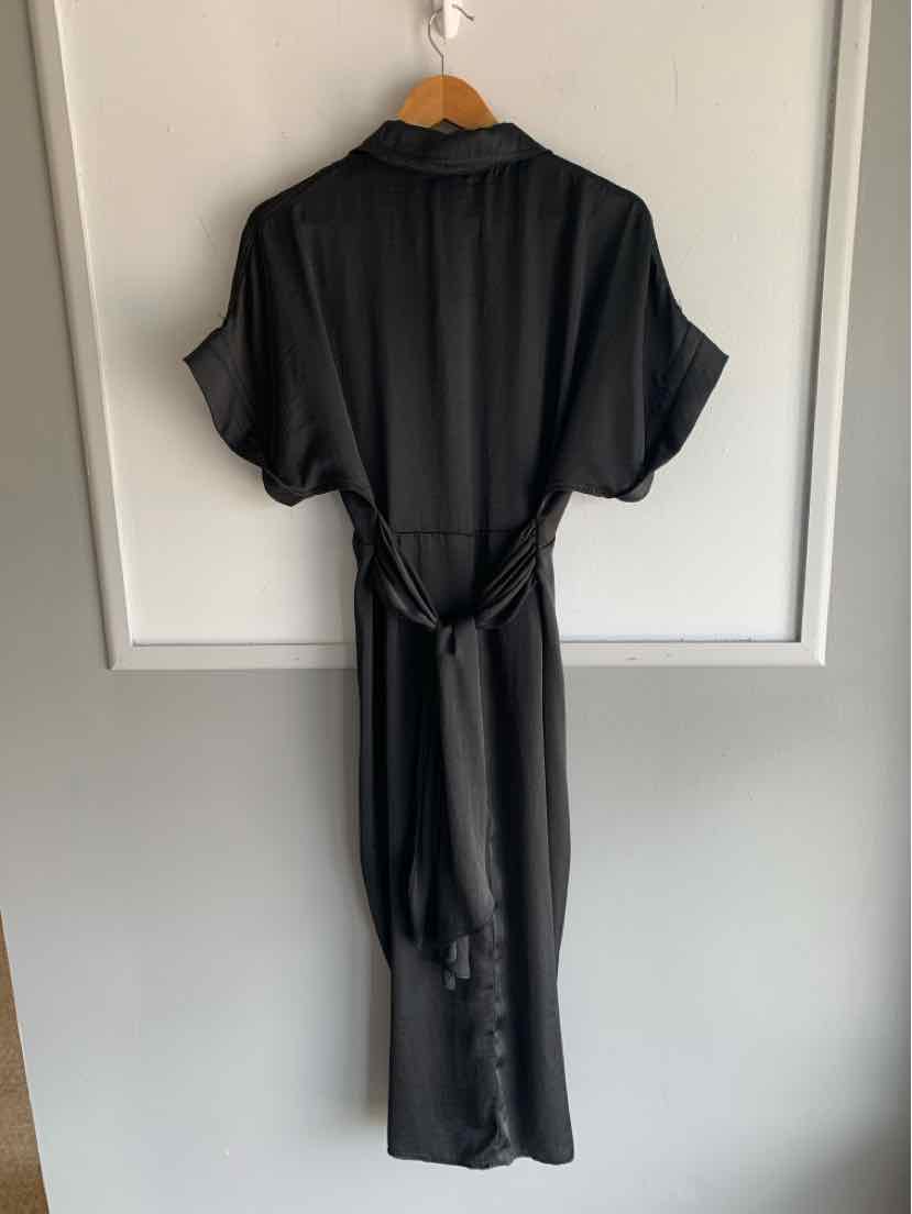Black satin midi dress with short sleeves, V-neck, and waist tie belt on wooden hanger.