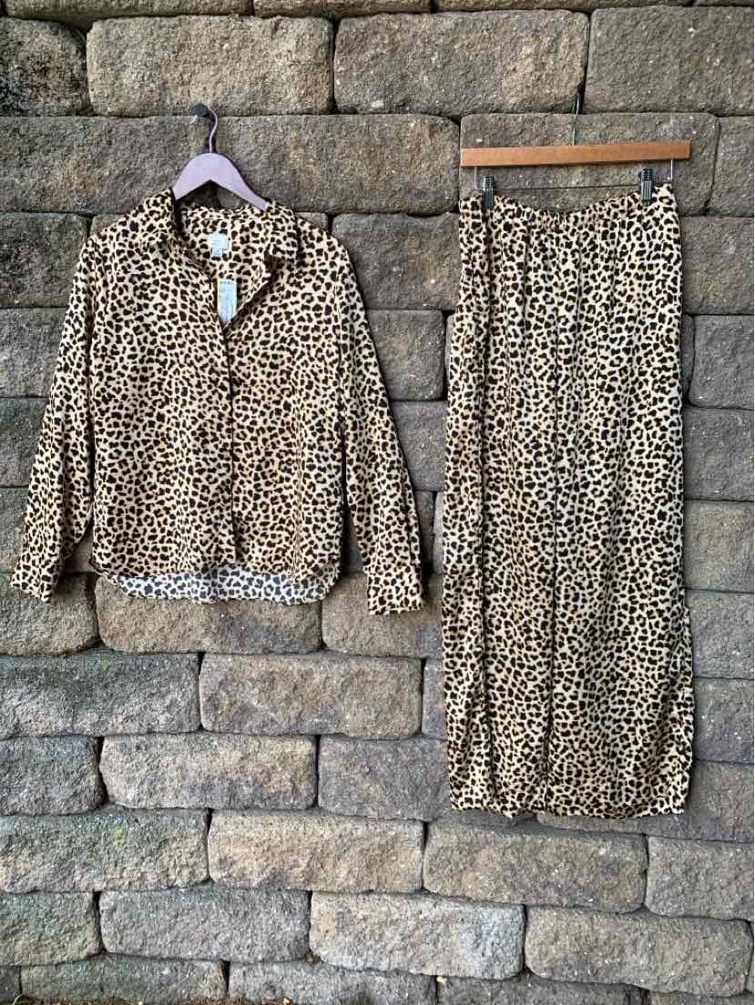 Two-piece cheetah print set with long-sleeve button-up shirt and matching wide-leg pants.