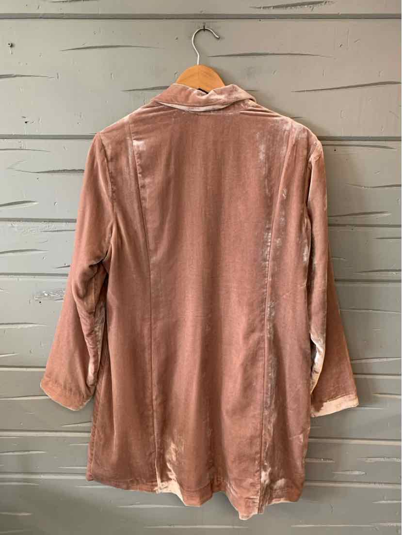 Mauve velvet long-sleeve jacket with a relaxed fit and a collar, shown from the back on a wooden hanger.