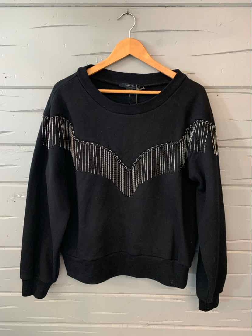 Black long-sleeve sweatshirt with chevron fringe detail across chest and shoulders, ribbed cuffs and hem.