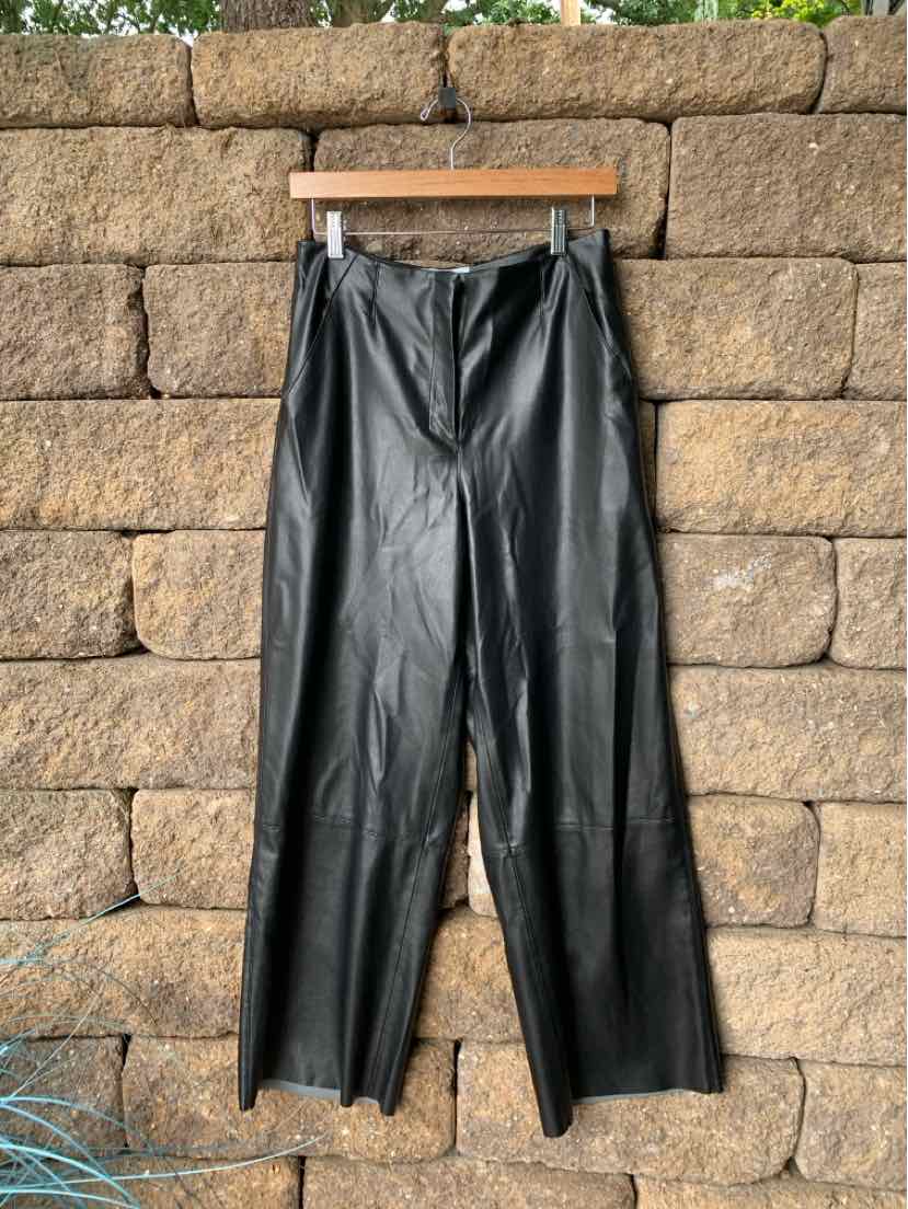 Black high-waist leather pants with straight legs and a front zipper closure.