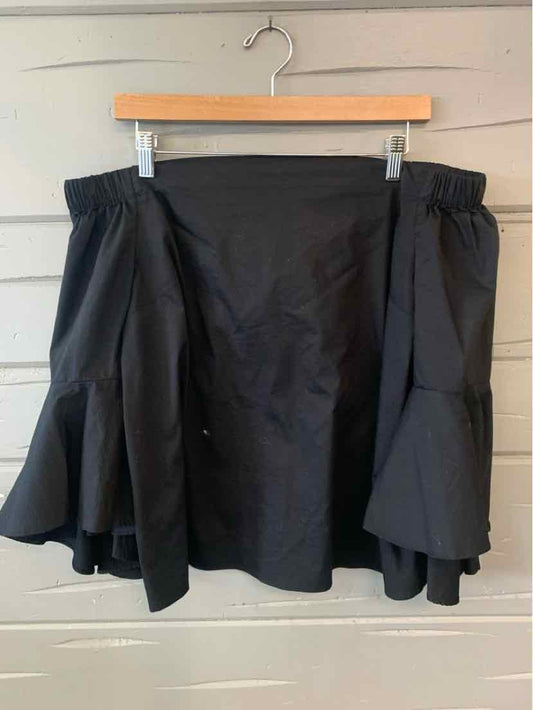 Black flared skirt with gathered elastic waistband and layered ruffle hem, size large.