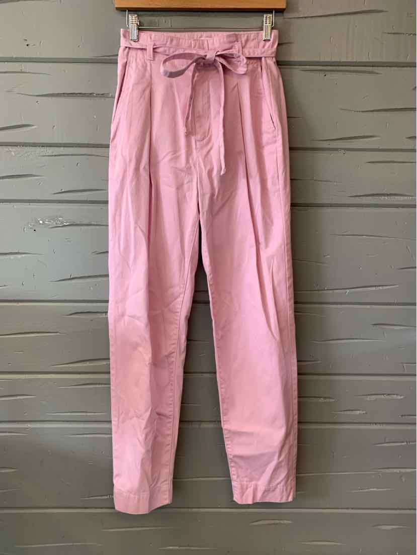 Soft pink toddler pants with a paperbag waist and a fabric belt tied in a bow.