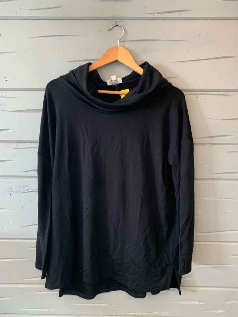 Black long-sleeve hoodie with a loose fit and slightly curved hem on a wooden hanger.