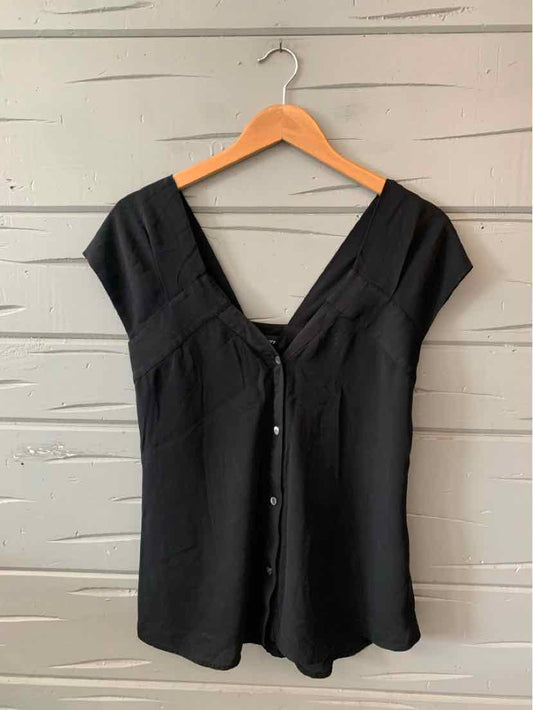 Black short-sleeve blouse with a V-neck and front buttons, slim fit, soft fabric.