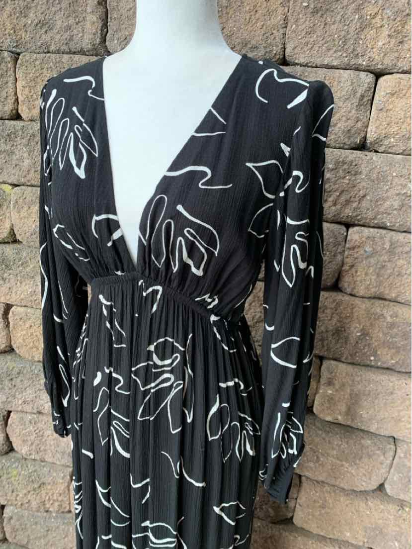 Black long-sleeve dress with white abstract floral line art and cinched waist, size small.