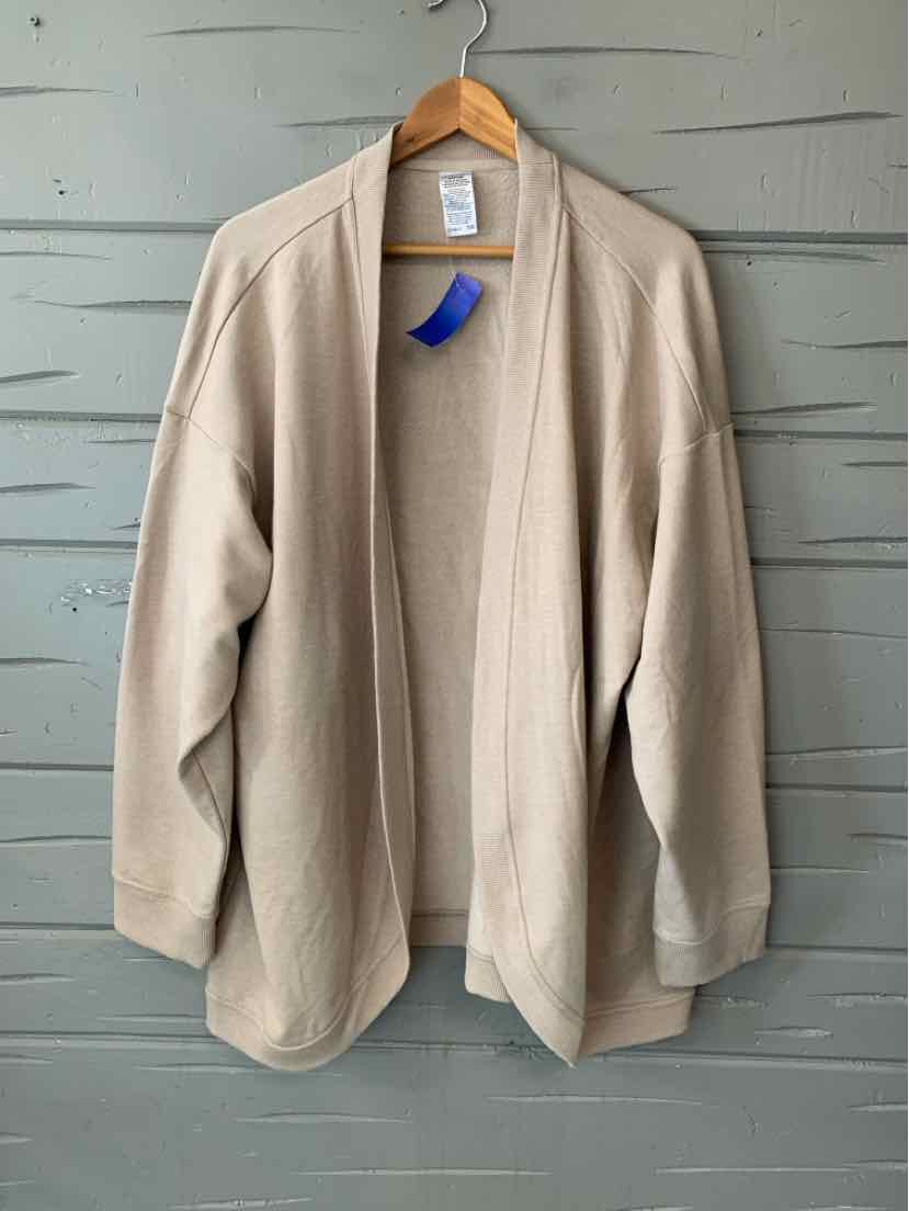 Tan Jockey women’s open-front blazer with notched lapels, long sleeves, and a softly draped fit.