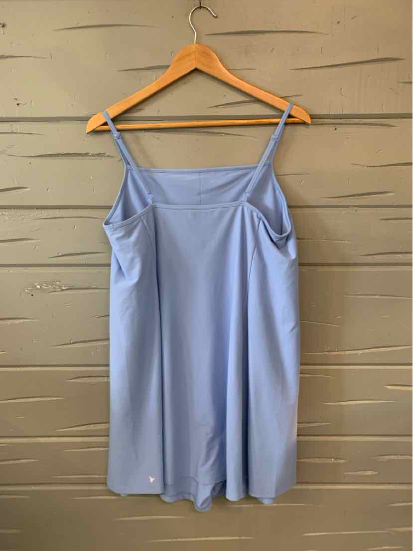 Light blue sleeveless dress with thin straps and a square neckline hanging on wooden hanger.