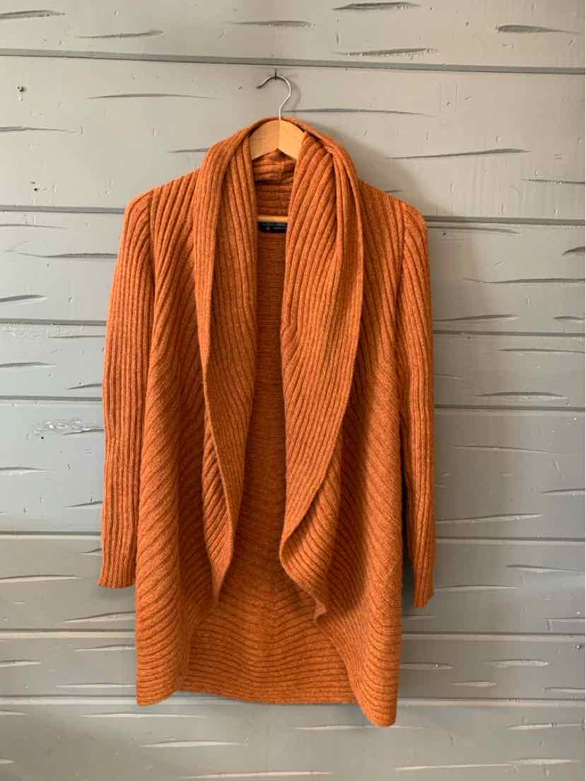 Burnt orange alpaca knit cardigan with long sleeves and wide shawl collar, oversized fit.