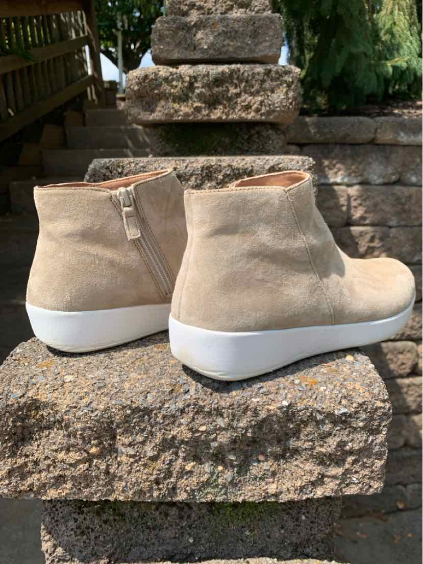 Beige suede wedge ankle shoes with side zippers and white soles, size 10.