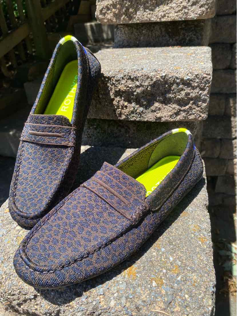 Women's size 10.5 leopard print loafers with textured fabric and bright yellow insoles.