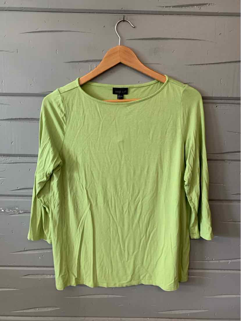 Light green long-sleeve knit top with scoop neckline and slim fit on wooden hanger.