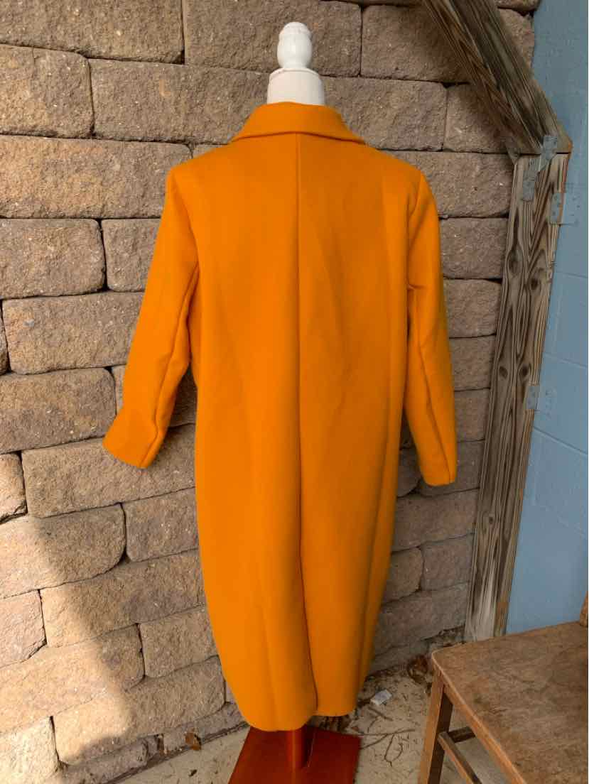 Bright orange long-sleeve coat with a wide collar and straight, knee-length silhouette, shown from the back.