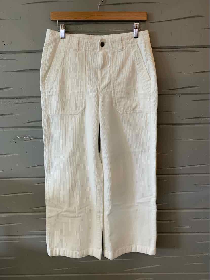 White wide-leg pants with front patch pockets and button closure, size 8.