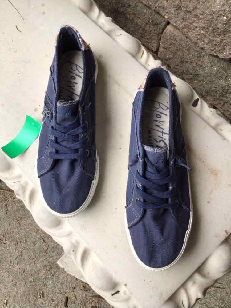 Navy blue canvas sneakers with white rubber soles and matching navy laces, size 11.