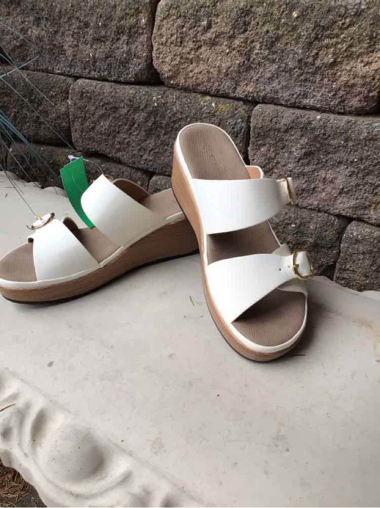 White open-toe slide sandals with wide straps and wooden wedge heels, size 39.