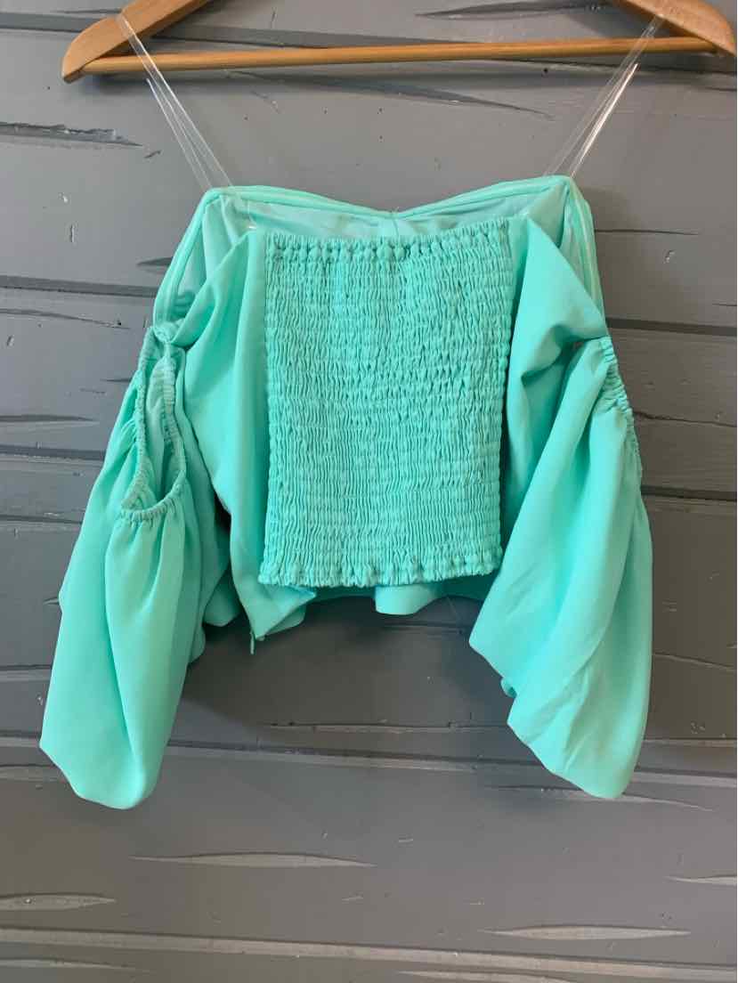 Mint green cropped blouse with smocked square neckline, ruched long puff sleeves, and spaghetti straps.