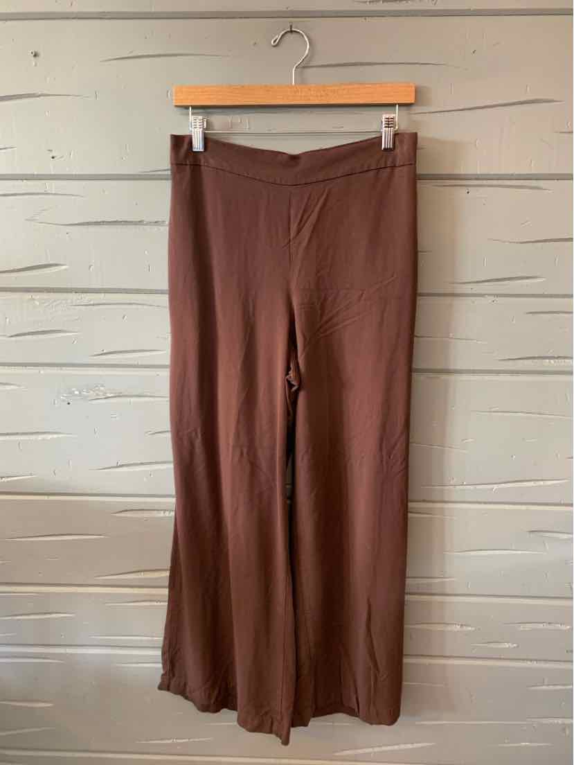 Brown wide-leg pants with a soft, stretchy fabric and subtle ruffle hem at the ankles.
