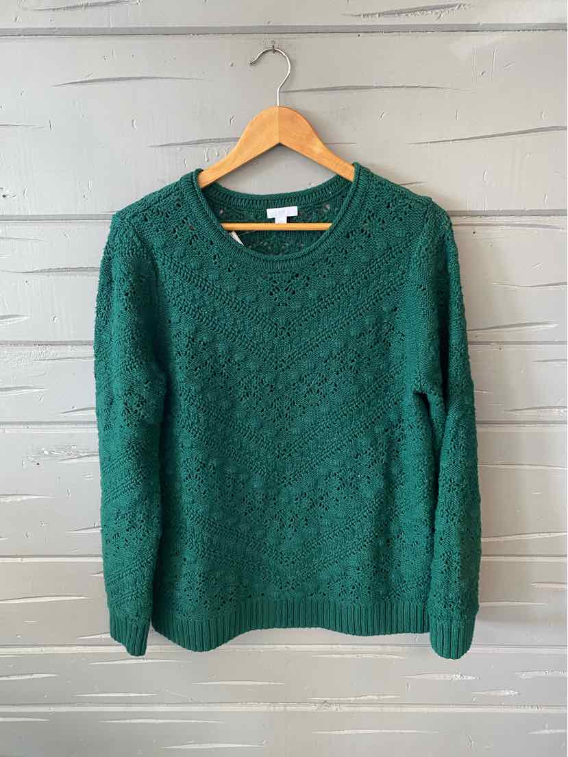 Green cable-knit long-sleeve crewneck sweater in medium size hanging on wooden hanger.