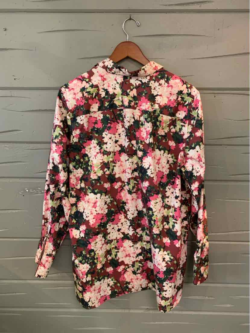 Long-sleeve button-up shirt with pink, white, and red floral print on black background.