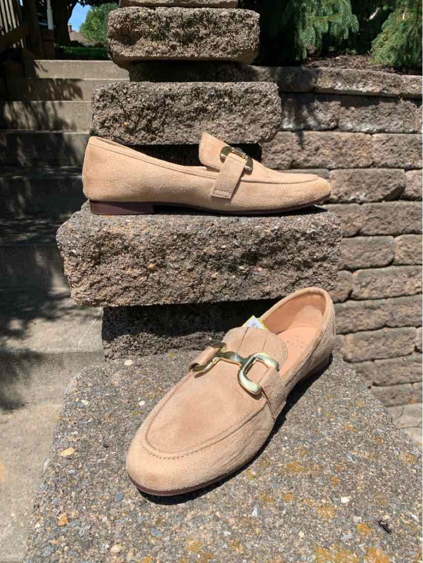 Beige suede loafer with gold-tone metal bit detail and almond toe, size 9.
