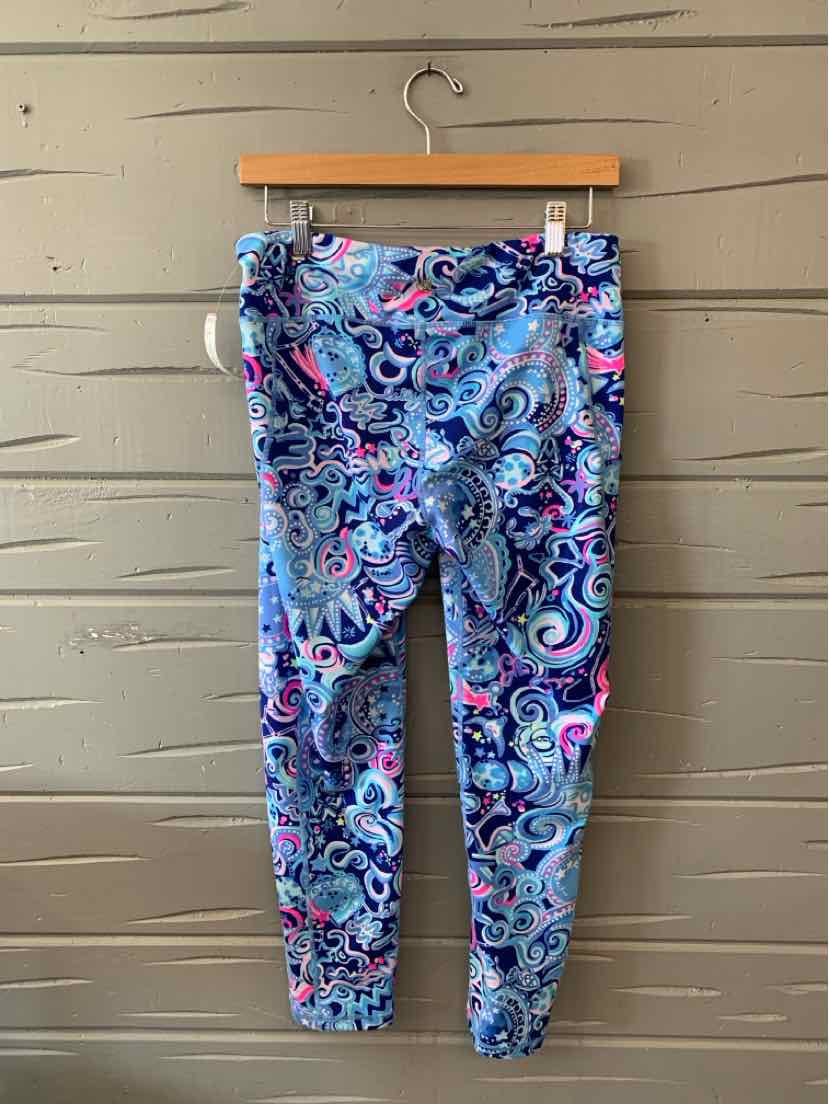 Slim-fit leggings with a vibrant multi-colored paisley pattern in shades of blue, pink, and white.